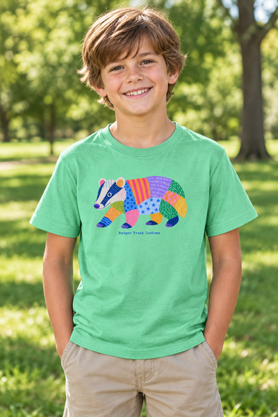 Child wearing the patchwork badger tee
