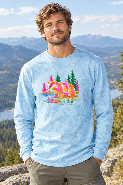Man wearing the colorful badger long-sleeve shirt at a mountain overlook