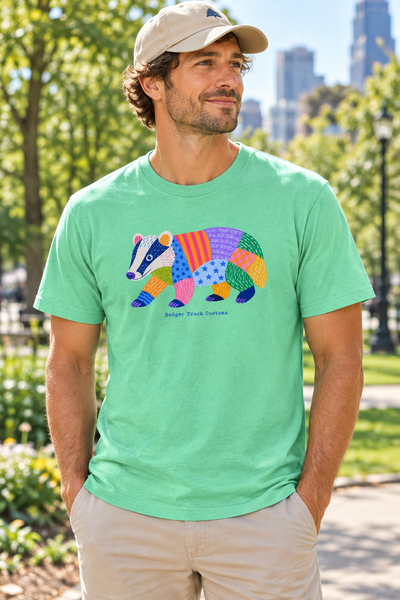 Man wearing the patchwork badger tee
