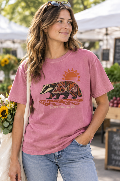Pink badger tee at an outdoor market