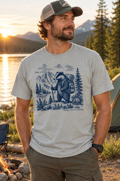 Take a Hike tee at a lakeside campsite