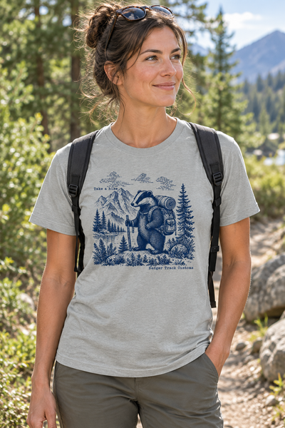 Take a Hike tee on a wooded trail