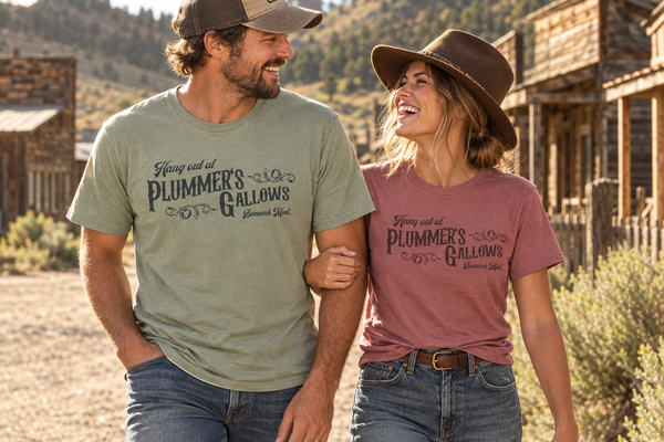 Thyme and Mauve Plummer’s Gallows tees outside historic buildings