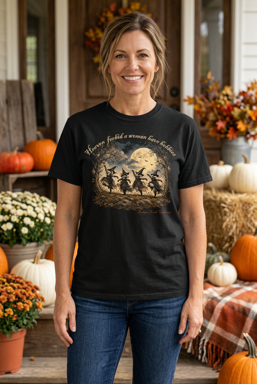 Woman wearing the witch badger tee on a fall porch