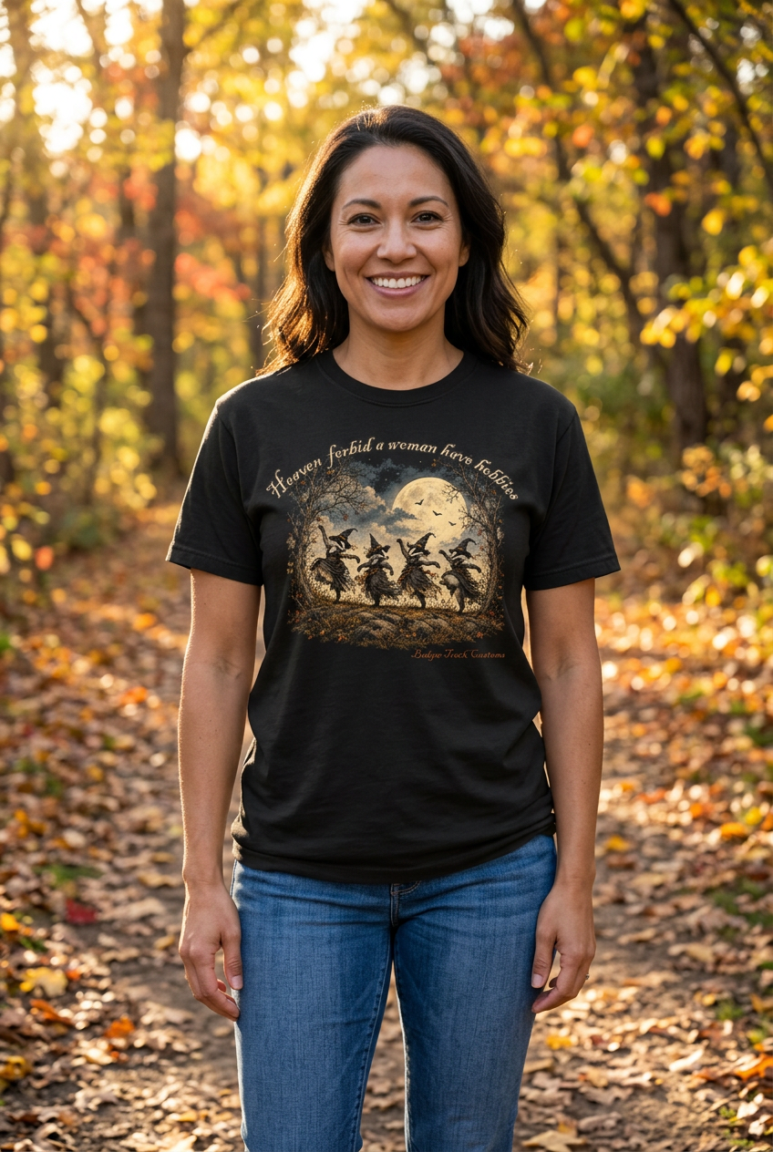 Woman wearing the witch badger tee on an autumn woodland path